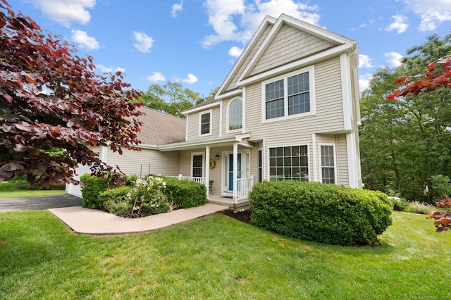 2 Spinnaker Dr Unit 2, East Lyme, CT 06357 - view of front of home featuring a front yard and a garage