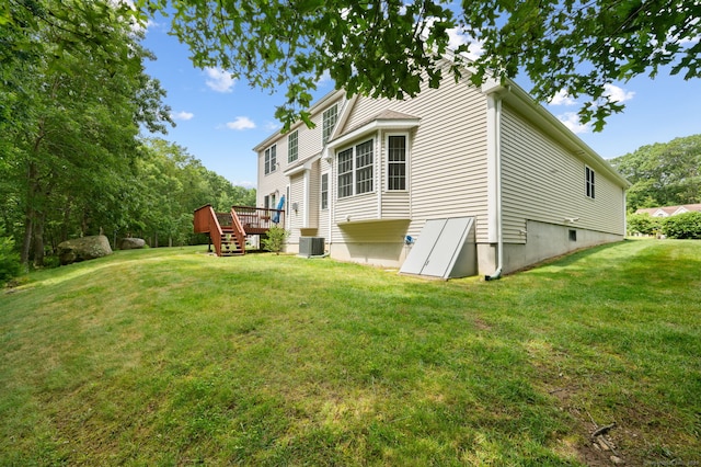 2 Spinnaker Dr Unit 2, East Lyme, CT 06357 - rear view of house featuring a wooden deck and a yard