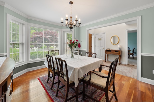 2 Spinnaker Dr Unit 2, East Lyme, CT 06357 - dining area featuring a chandelier, light wood-style flooring, plenty of natural light, and crown molding