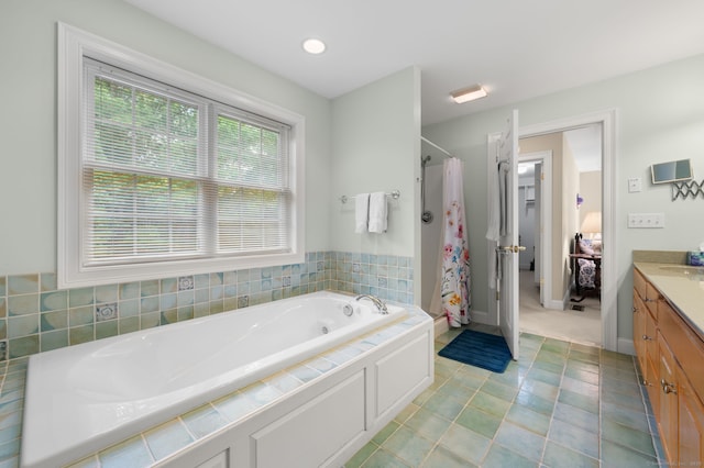 2 Spinnaker Dr Unit 2, East Lyme, CT 06357 - bathroom with vanity, a shower stall, and a garden tub