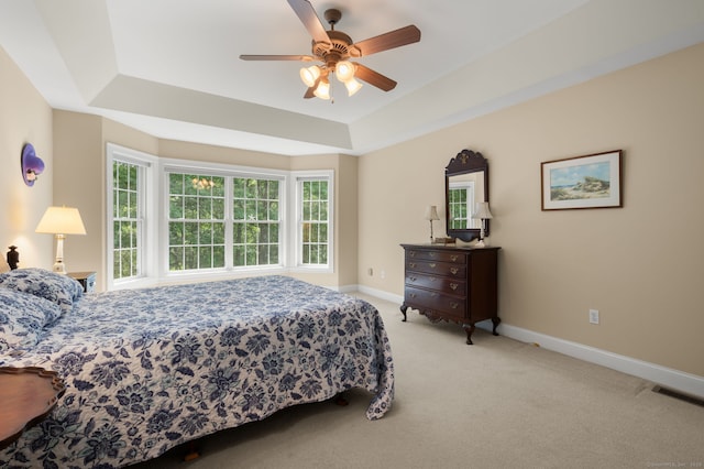 2 Spinnaker Dr Unit 2, East Lyme, CT 06357 - carpeted bedroom featuring a tray ceiling and ceiling fan