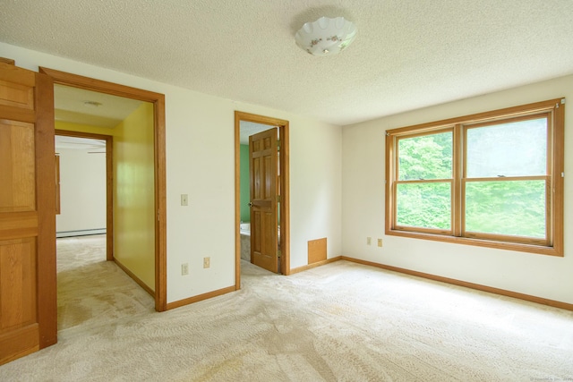 132 Wade Rd, Pomfret, CT 06259 - unfurnished bedroom featuring light colored carpet, a textured ceiling, and a baseboard heating unit