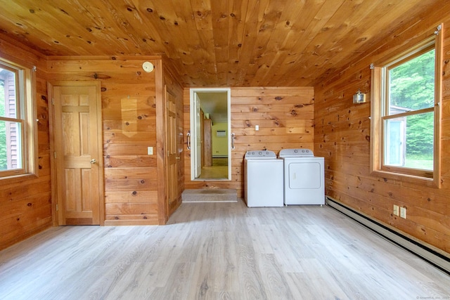 132 Wade Rd, Pomfret, CT 06259 - washroom with a baseboard radiator, washing machine and clothes dryer, wood walls, light wood-type flooring, and wooden ceiling