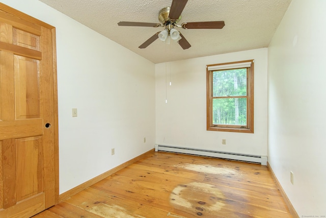 132 Wade Rd, Pomfret, CT 06259 - spare room with baseboard heating, light wood-style floors, ceiling fan, and a textured ceiling