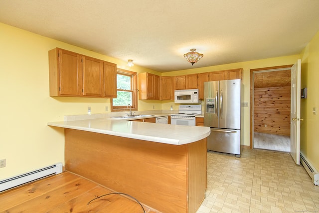 132 Wade Rd, Pomfret, CT 06259 - kitchen featuring white appliances, a baseboard radiator, light countertops, and a peninsula