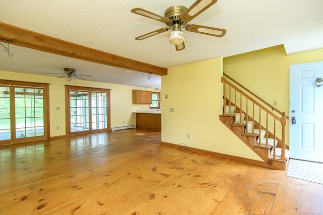 132 Wade Rd, Pomfret, CT 06259 - unfurnished living room featuring a baseboard radiator, a ceiling fan, stairs, beamed ceiling, and light wood-type flooring