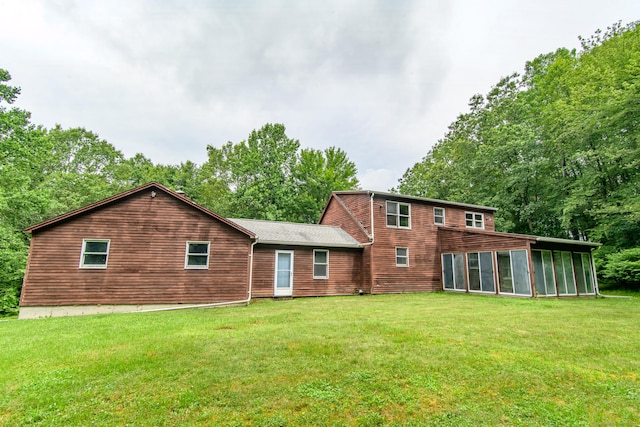 132 Wade Rd, Pomfret, CT 06259 - back of property featuring a sunroom and a lawn