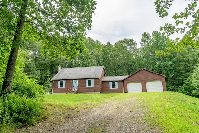 132 Wade Rd, Pomfret, CT 06259 - view of front facade with driveway, a garage, a front lawn, and a chimney