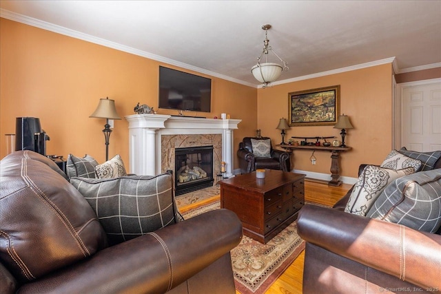 70 Albemarle St, Bridgeport, CT 06606 - living room with wood finished floors, crown molding, and a fireplace