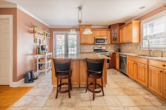 70 Albemarle St, Bridgeport, CT 06606 - kitchen featuring stainless steel appliances, decorative backsplash, plenty of natural light, glass insert cabinets, and crown molding