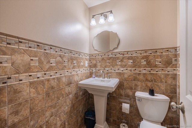 70 Albemarle St, Bridgeport, CT 06606 - half bath featuring tile walls and a wainscoted wall