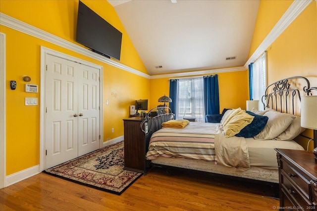 70 Albemarle St, Bridgeport, CT 06606 - bedroom featuring vaulted ceiling, multiple windows, and wood finished floors