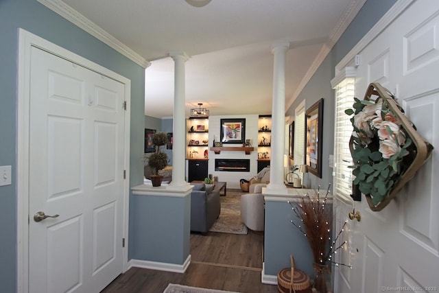 362 Main St, Meriden, CT 06451 - foyer entrance with decorative columns, crown molding, dark wood-type flooring, and a glass covered fireplace