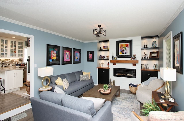 362 Main St, Meriden, CT 06451 - living room with ornamental molding, wood finished floors, and a glass covered fireplace