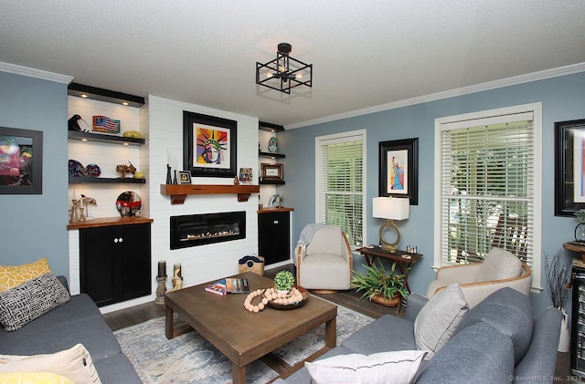 362 Main St, Meriden, CT 06451 - living room featuring wood finished floors, ornamental molding, and a large fireplace