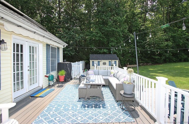 362 Main St, Meriden, CT 06451 - wooden deck with an outdoor living space, an outdoor structure, a yard, view of scattered trees, and french doors