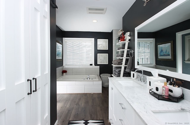362 Main St, Meriden, CT 06451 - full bathroom with a bath, double vanity, plenty of natural light, wood finished floors, and recessed lighting