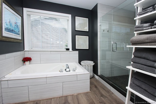362 Main St, Meriden, CT 06451 - bathroom featuring a shower stall, a bath, and wood finished floors