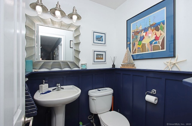 362 Main St, Meriden, CT 06451 - half bath with a decorative wall and a wainscoted wall