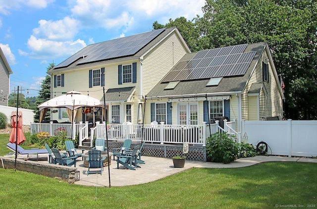 362 Main St, Meriden, CT 06451 - rear view of house featuring roof mounted solar panels, a patio area, a fire pit, a deck, and roof with shingles