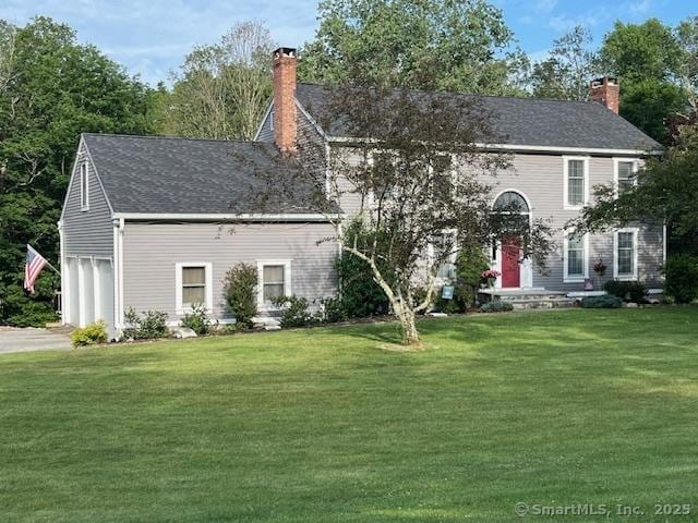 47 Merwin Brook Rd, Brookfield, CT 06804 - colonial home featuring a chimney, a front yard, driveway, and a garage