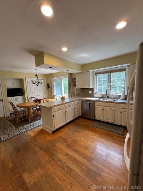 47 Merwin Brook Rd, Brookfield, CT 06804 - kitchen with freestanding refrigerator, dishwasher, a peninsula, plenty of natural light, and recessed lighting