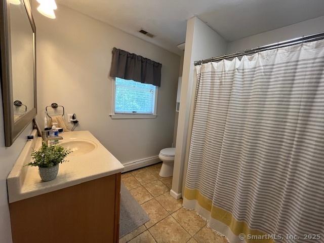 47 Merwin Brook Rd, Brookfield, CT 06804 - bathroom featuring baseboard heating, tile patterned flooring, vanity, and a shower with shower curtain