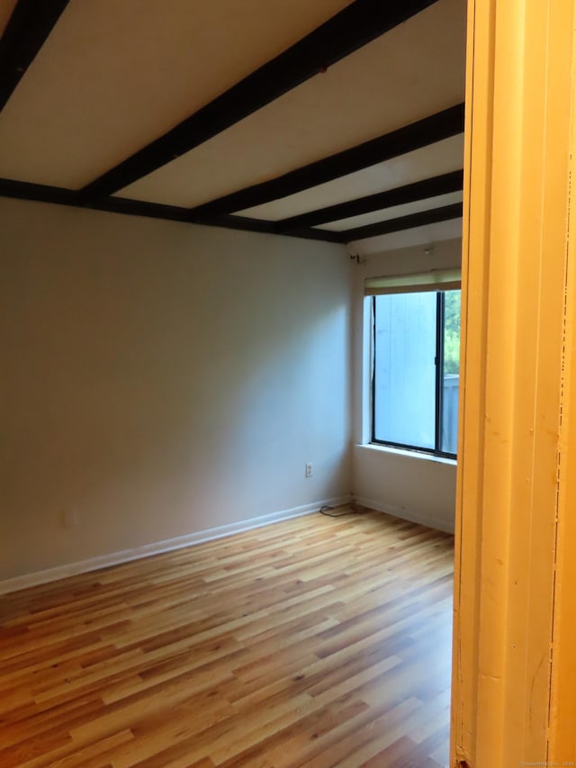 1 Birch Ln Unit D, East Haven, CT 06513 - empty room featuring beamed ceiling and light wood-style flooring