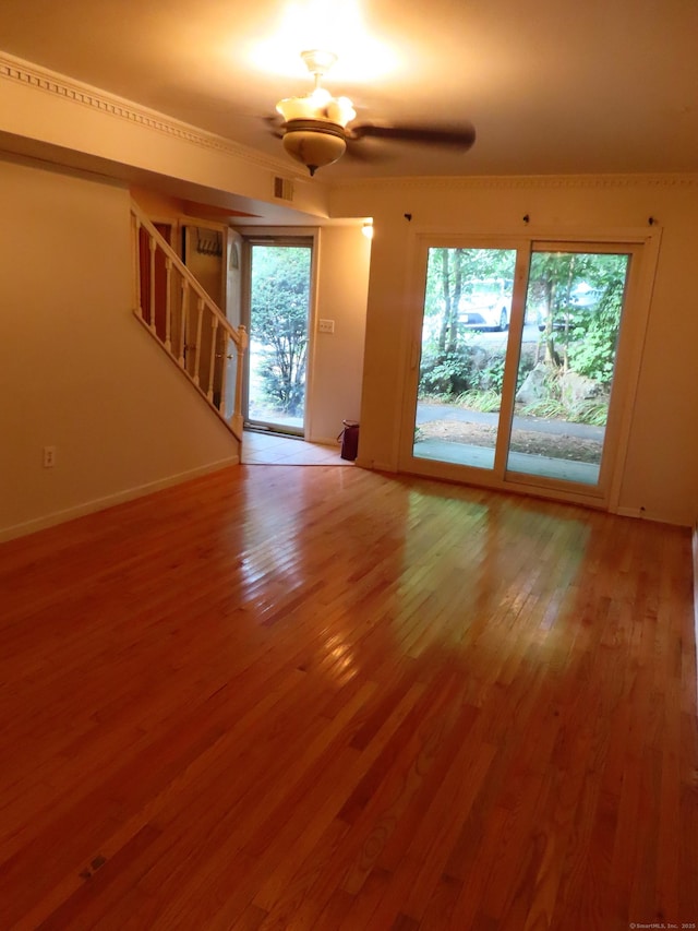 1 Birch Ln Unit D, East Haven, CT 06513 - unfurnished living room with stairs and wood finished floors