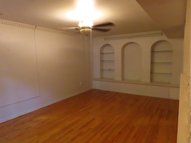 1 Birch Ln Unit D, East Haven, CT 06513 - unfurnished room featuring ceiling fan, wood finished floors, and built in shelves