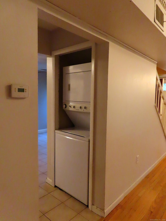 1 Birch Ln Unit D, East Haven, CT 06513 - washroom featuring stacked washer / drying machine and light tile patterned floors