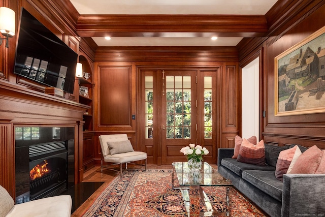 354 S Ave, New Canaan, CT 06840 - living area with wood finished floors, a premium fireplace, a decorative wall, healthy amount of natural light, and crown molding