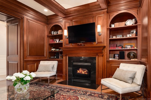 354 S Ave, New Canaan, CT 06840 - sitting room with built in features, a fireplace with flush hearth, and ornamental molding