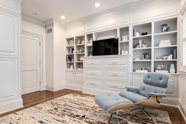 354 S Ave, New Canaan, CT 06840 - sitting room featuring dark wood-style floors, built in shelves, an office area, ornamental molding, and recessed lighting