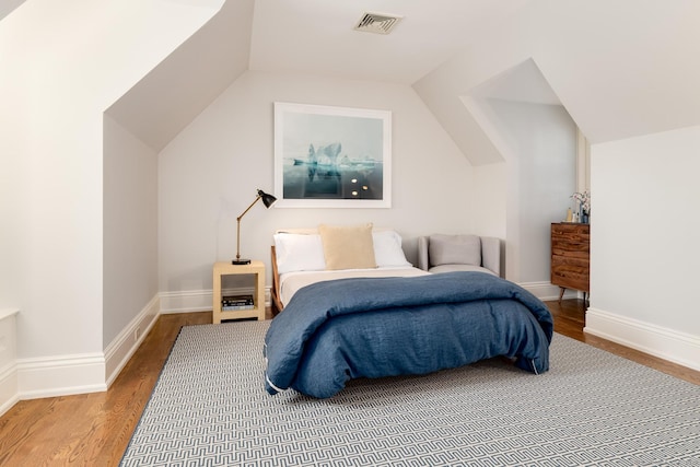 354 S Ave, New Canaan, CT 06840 - bedroom with vaulted ceiling and wood finished floors