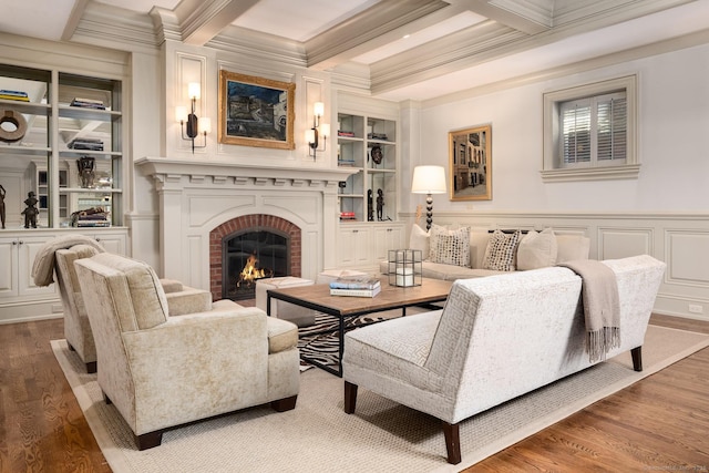 354 S Ave, New Canaan, CT 06840 - living room featuring crown molding, wood finished floors, a brick fireplace, beam ceiling, and built in features