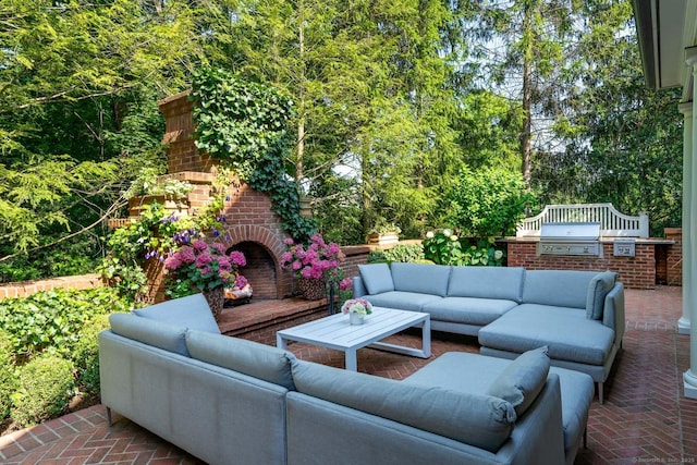 354 S Ave, New Canaan, CT 06840 - view of patio featuring exterior kitchen and an outdoor living space with a fireplace