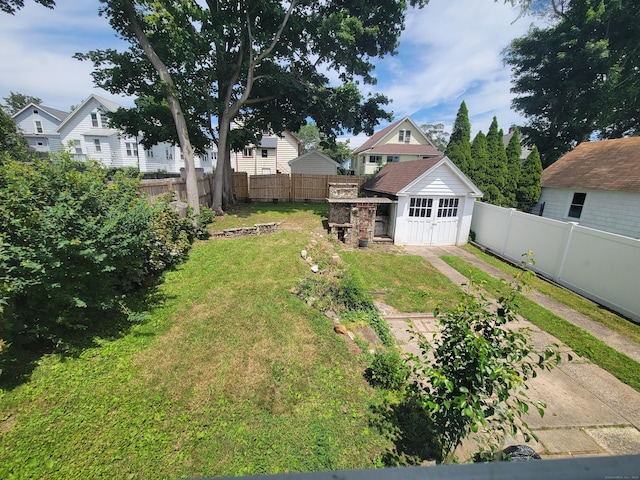87 Fairview Ave, West Haven, CT 06516 - fenced backyard with an outdoor structure