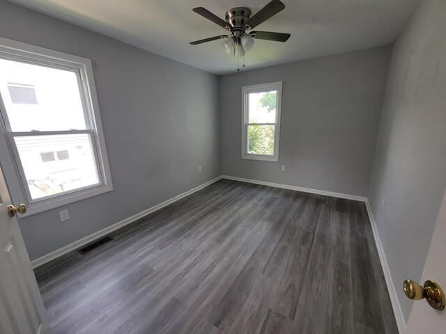 87 Fairview Ave, West Haven, CT 06516 - empty room with dark wood-type flooring and a ceiling fan