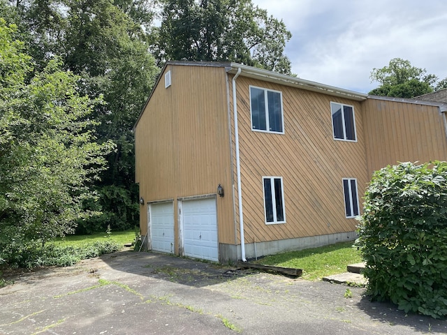 127 Nicole Dr, Milford, CT 06460 - view of side of home with a garage