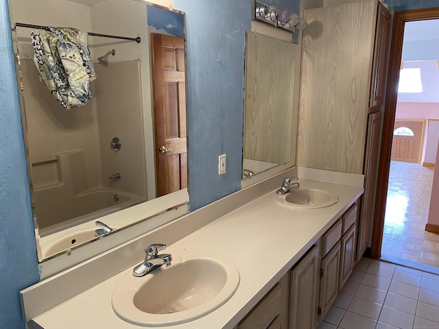 127 Nicole Dr, Milford, CT 06460 - full bathroom with double vanity, tile patterned flooring, and shower / bathtub combination