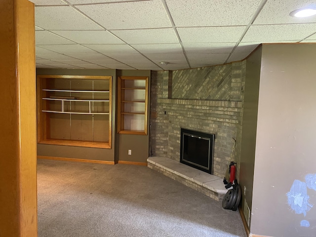 127 Nicole Dr, Milford, CT 06460 - unfurnished living room featuring carpet, a drop ceiling, and a fireplace