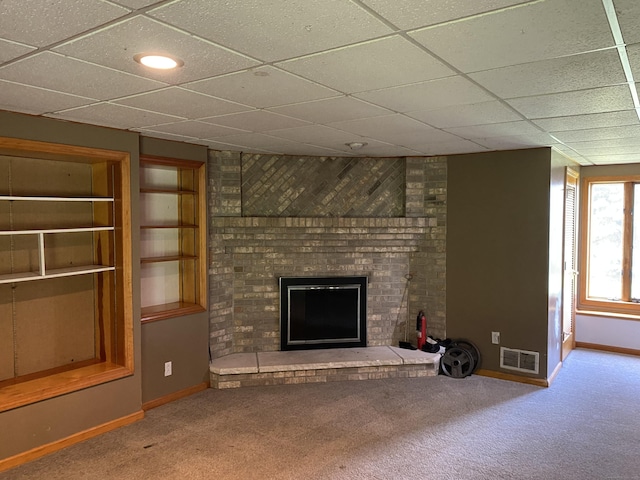 127 Nicole Dr, Milford, CT 06460 - unfurnished living room featuring carpet, a brick fireplace, and a paneled ceiling