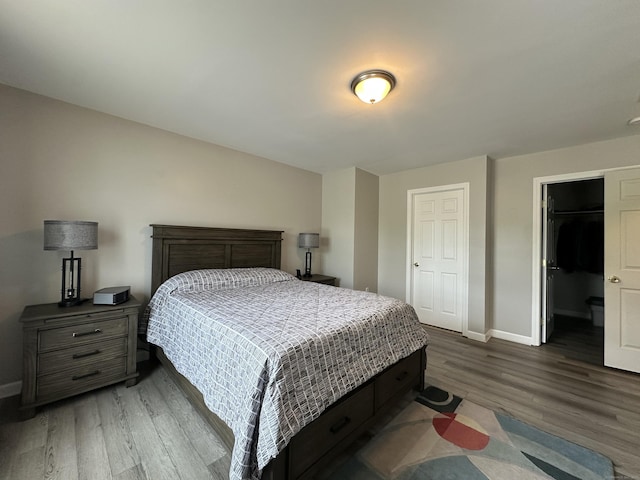 39 Ames Ave Unit A, Meriden, CT 06451 - bedroom with wood finished floors, a closet, and a walk in closet