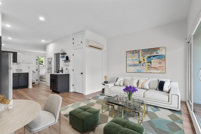 16 Pine Orchard Rd Apt 18, Branford, CT 06405 - living room featuring a wall mounted air conditioner, light wood-style floors, and recessed lighting