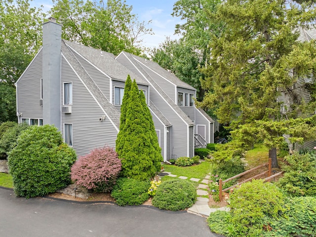 421 Glenbrook Rd Apt 2, Stamford, CT 06906 - view of side of home featuring a shingled roof and a chimney