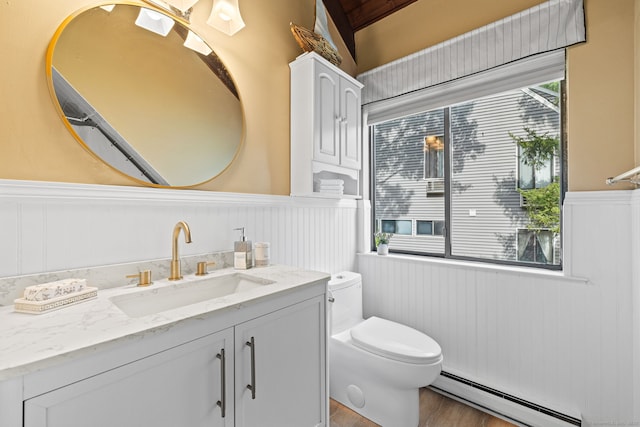 421 Glenbrook Rd Apt 2, Stamford, CT 06906 - bathroom with a baseboard heating unit, wainscoting, vanity, and wood finished floors