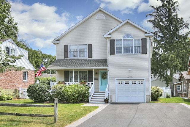1221 Merritt St, Fairfield, CT 06825 - traditional-style house featuring covered porch, driveway, an attached garage, and roof with shingles