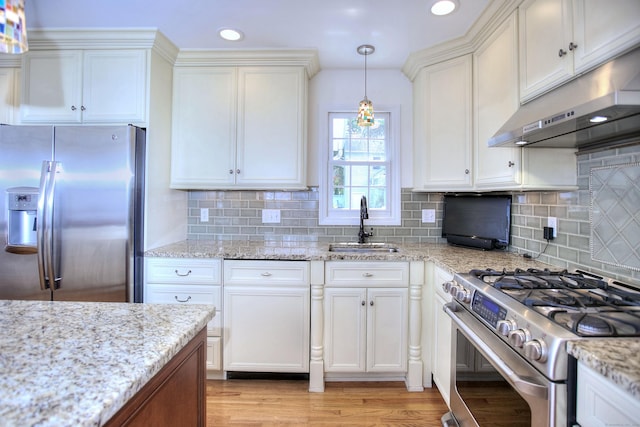 1221 Merritt St, Fairfield, CT 06825 - kitchen with appliances with stainless steel finishes, under cabinet range hood, white cabinetry, and recessed lighting