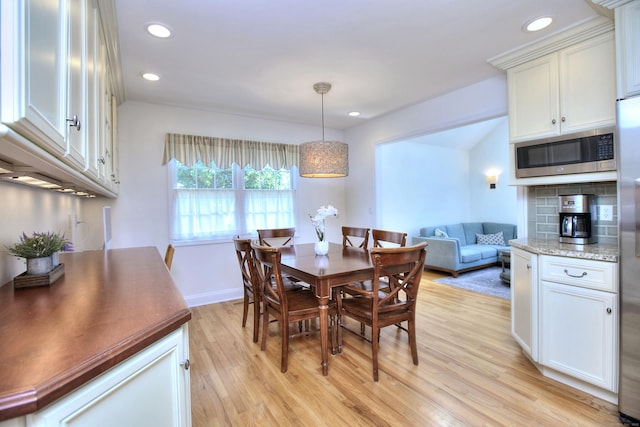 1221 Merritt St, Fairfield, CT 06825 - dining space with light wood-type flooring and recessed lighting